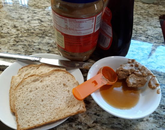 Ingredients for a peanut butter and syrup sandwich