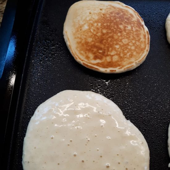 Bubbles on top indicate a pancake is ready to turn.