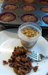 Crumbles show inside a Keto Carrot Cupcake before it is frosted.